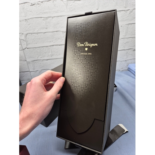 731 - A 75cl Bottle of Dom Perignon 2004 Champagne with Box and Booklet