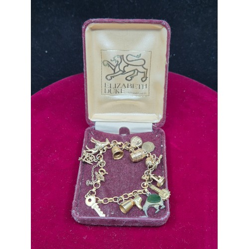 69 - A 9ct Gold Charm Bracelet (Gold Weight approx 15g)