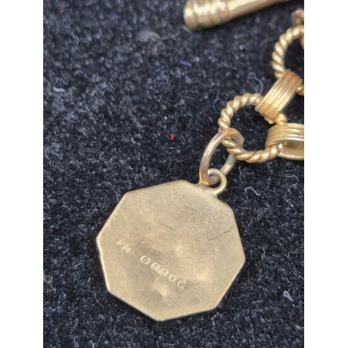 69 - A 9ct Gold Charm Bracelet (Gold Weight approx 15g)