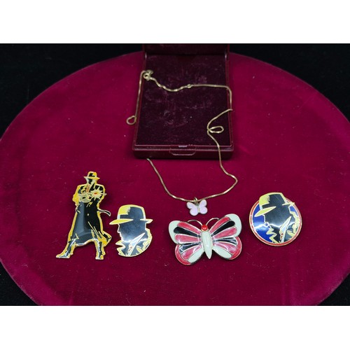 73 - A Mixed Lot to include Three Dick Tracy Pin Badges, an Enamel Butterfly Brooch and a Butterfly Neckl... 