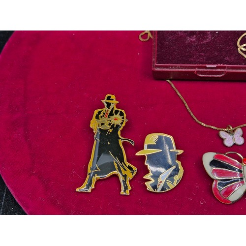 73 - A Mixed Lot to include Three Dick Tracy Pin Badges, an Enamel Butterfly Brooch and a Butterfly Neckl... 
