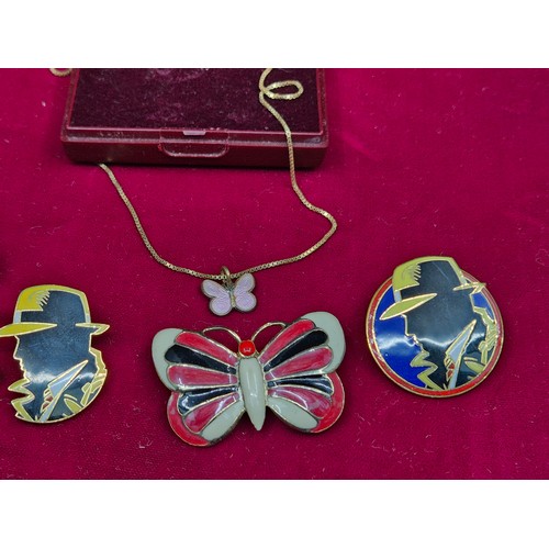 73 - A Mixed Lot to include Three Dick Tracy Pin Badges, an Enamel Butterfly Brooch and a Butterfly Neckl... 