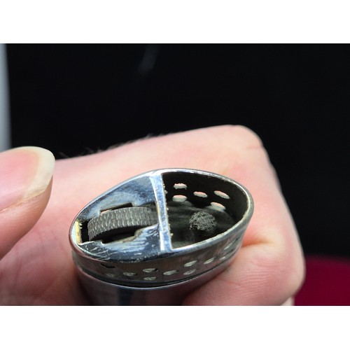 74 - An Antique GPO Whistle together with a Vintage Tommy Lighter