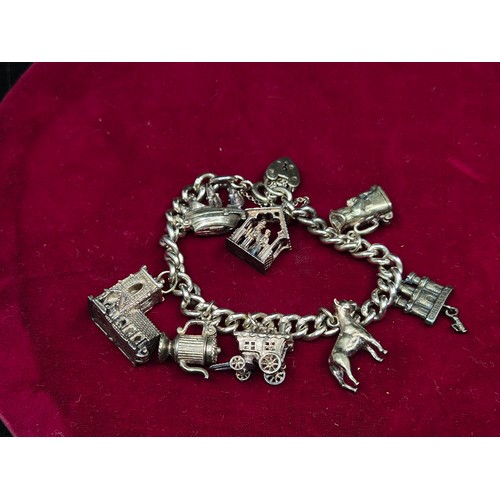 75 - A Sterling Sliver Charm Bracelet (approx 60.8g)
