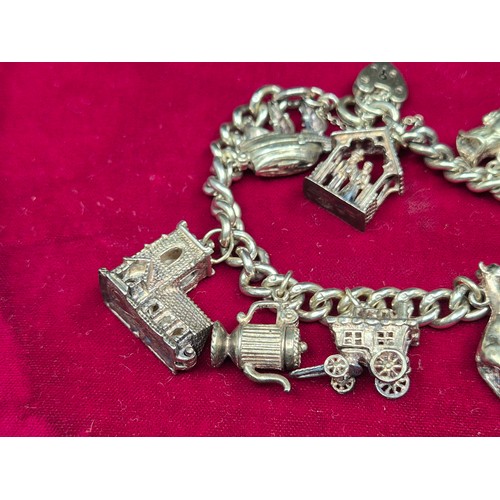 75 - A Sterling Sliver Charm Bracelet (approx 60.8g)