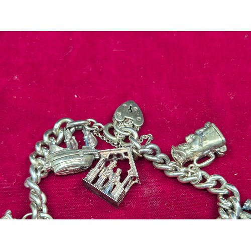 75 - A Sterling Sliver Charm Bracelet (approx 60.8g)