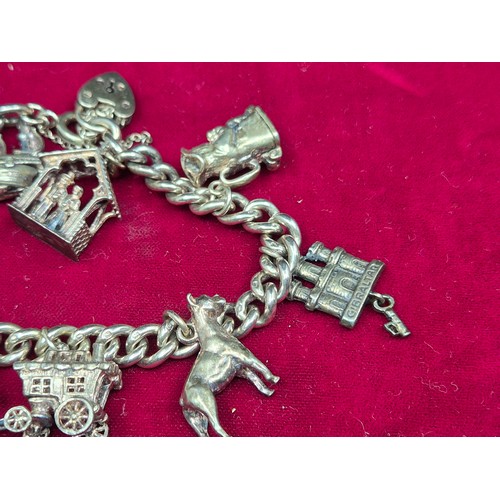 75 - A Sterling Sliver Charm Bracelet (approx 60.8g)