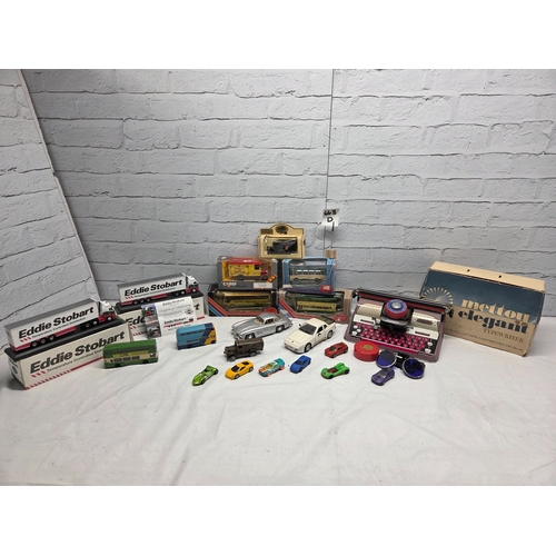 668D - A mixed lot of vintage and collectable items to include die-cast model vehicles including boxed Eddi... 