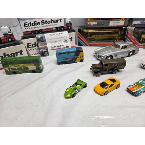 668D - A mixed lot of vintage and collectable items to include die-cast model vehicles including boxed Eddi... 