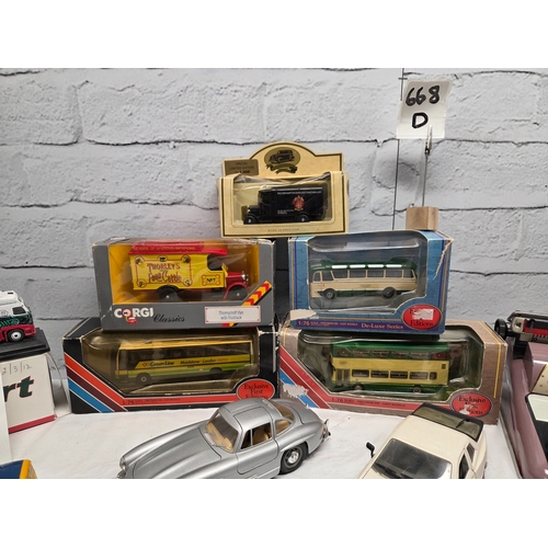 668D - A mixed lot of vintage and collectable items to include die-cast model vehicles including boxed Eddi... 
