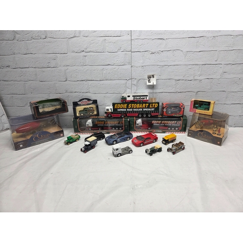 668E - A mixed collection of Die-Cast Model Vehicles to include boxed Eddie Stobart articulated lorries, Ma... 