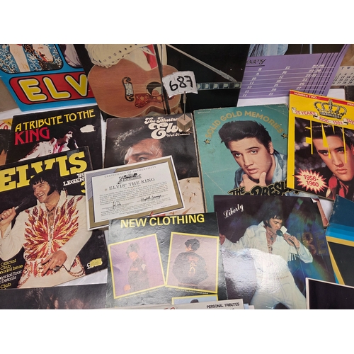 687 - A Collection of Elvis Presley Memorabilia to include Vinyl, Magazines and more