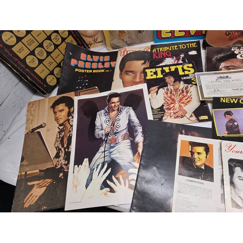 687 - A Collection of Elvis Presley Memorabilia to include Vinyl, Magazines and more
