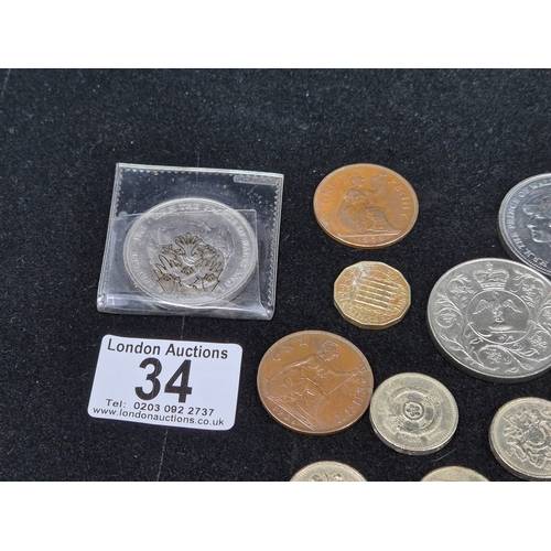 34 - A mixed lot of assorted UK Coins to include a £2 coins, £1 coins etc