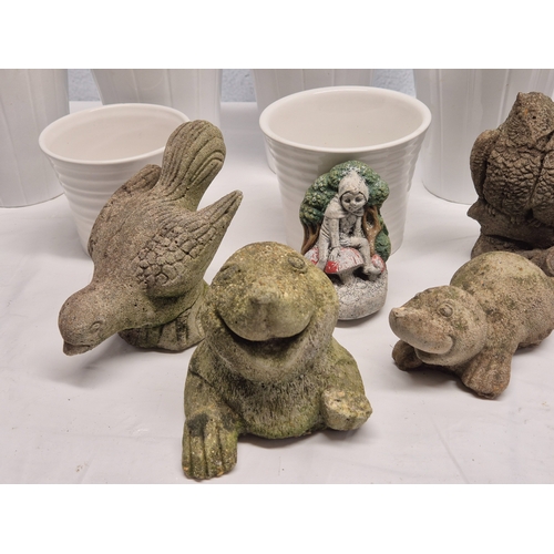 665A - A Collection of weathered Garden Ornaments together with six Flowerpots
