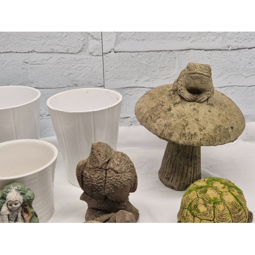 665A - A Collection of weathered Garden Ornaments together with six Flowerpots
