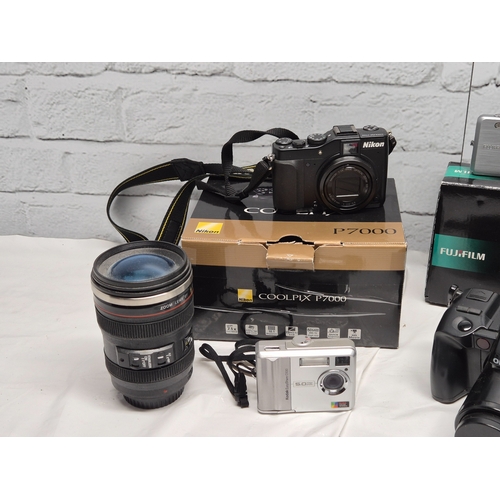 675C - A Collection of Modern Cameras/Equipment to include Panasonic Lumix DMC-FZ1000, Nikon Coolpix P7000,... 
