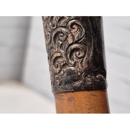 676A - A Collection of Walking Sticks to include Silver Handled example