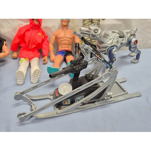 Collection of Action Man figures including soldier, robot dog, and ...