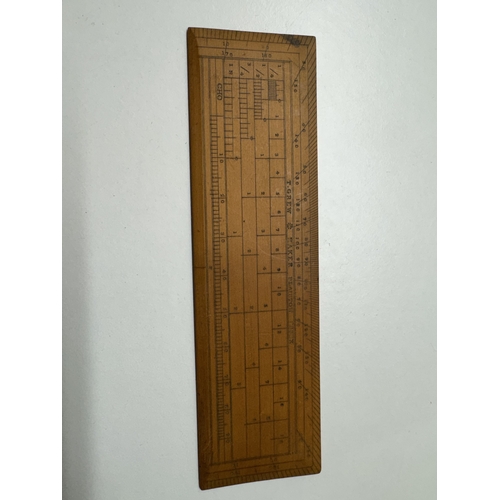 A collection of vintage drawing and measuring instruments, including a ...