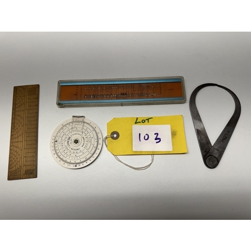 A collection of vintage drawing and measuring instruments, including a ...