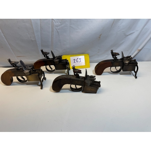 Dunhill: A group of four rare tinder flintlock pistol table lighters