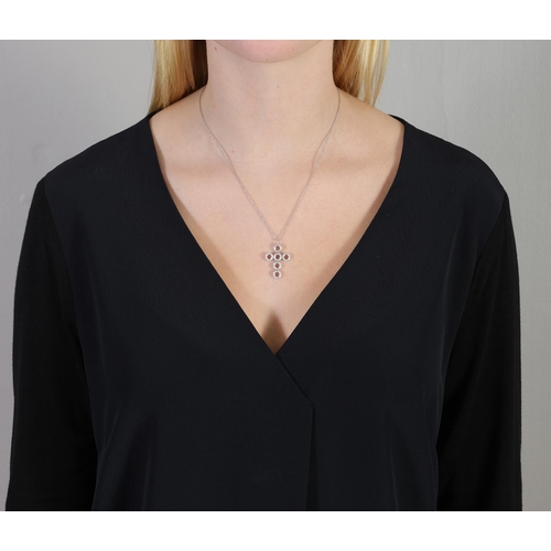 18 - A TOPAZ AND DIAMOND PENDANT NECKLACE, the pendant designed as a cross, reversibly mounted with circu... 