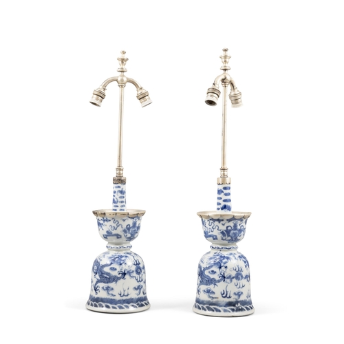 115 - A PAIR OF BLUE AND WHITE PORCELAIN DRAGON CANDLESTICKS  19??? ??????????  China, late 19th century... 