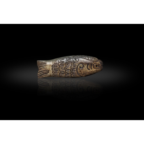 181 - A GROUP OF TWO JADE ARCHERS RINGS AND FISH  ??-20??????????????  D: 3.1cm; L: 8.2cm  (2)