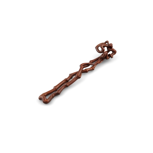 38 - *A BAMBOO IMITATION WOODEN RUYI SCEPTRE  ?? 20?? ?????  China, 20th century.  L: 30.2 cm Weight: 78.... 