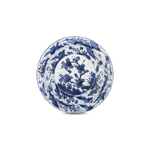 77 - TWO BLUE AND WHITE CHARGERS, ONE FLOWER-SHAPED DECORATED WITH FLOWERS AND LANDSCAPE, MARKED WITH A F... 