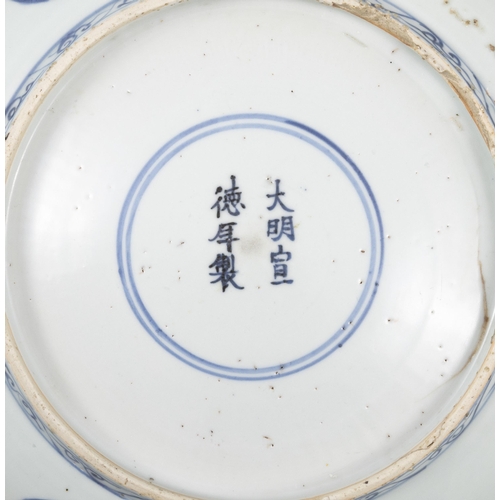 77 - TWO BLUE AND WHITE CHARGERS, ONE FLOWER-SHAPED DECORATED WITH FLOWERS AND LANDSCAPE, MARKED WITH A F... 