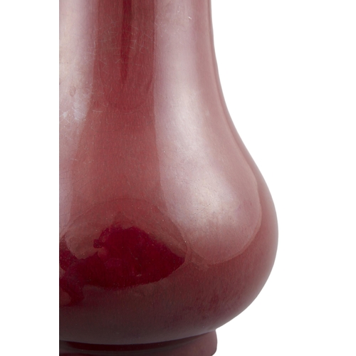 96 - *A FLAMBE / OXBLOOD GLAZED PORCELAIN BALUSTER VASE  ?? ?????  Qing dynasty It rests on a spread foot... 