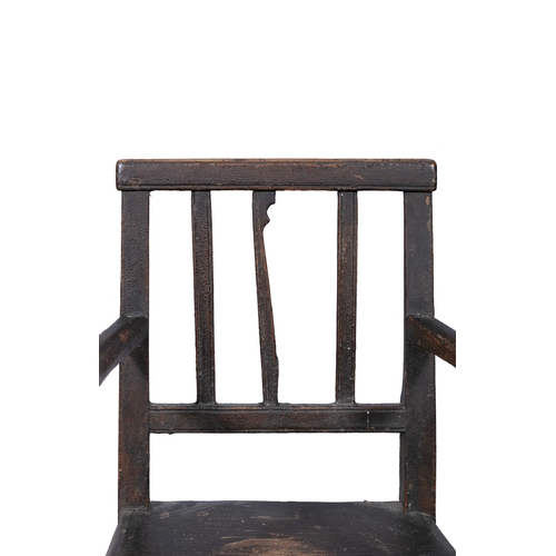 101 - A 19TH CENTURY PAINTED PINE CHILDS HIGH CHAIR  with stick back and bowed armrest on canted square su... 