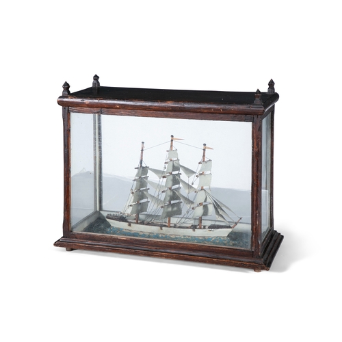 127 - A DIORAMA OF A THREE MASTED SQUARE RIGGED MODEL BARK SHIP  the stained timber case of rectangular fo... 