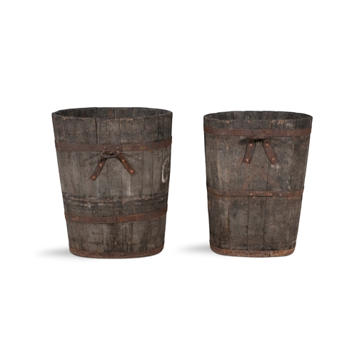 13 - TWO 19TH CENTURY BRASS BANDED TURF BUCKETS,  of shaped oval form and coopered construction, with app... 