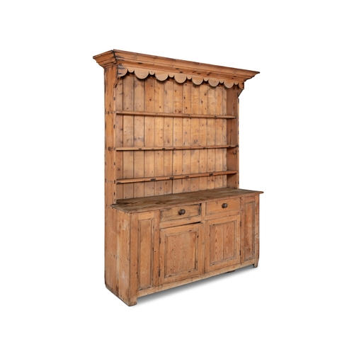 145 - A 19TH CENTURY WELSH DRESSER,  the top section with moulded canope cornice, above three shelves, wit... 