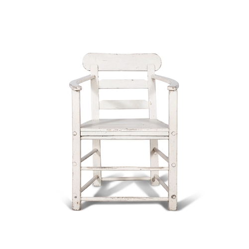 153 - A WHITE PAINTED PINE ARCMCHAIR  with ladder back and slightly bowed armrests, panelled seat and squa... 