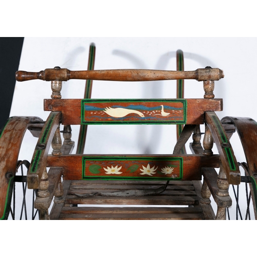 155 - A CHILD'S PONY TRAP WITH BACK TO BACK SEATS,   the timber frame with painted decoration, with steel ... 