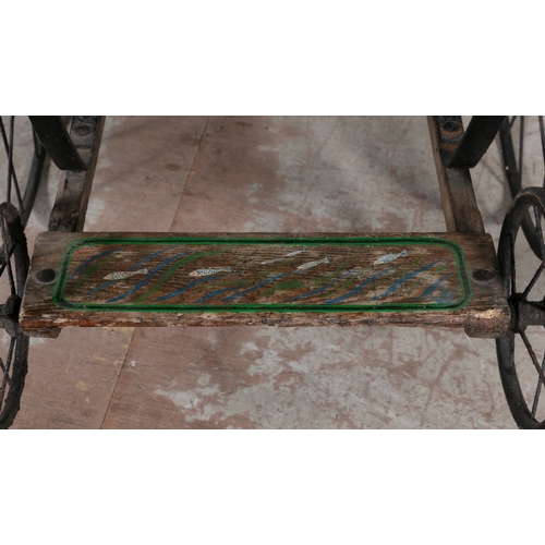 155 - A CHILD'S PONY TRAP WITH BACK TO BACK SEATS,   the timber frame with painted decoration, with steel ... 