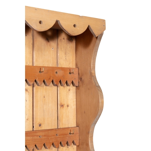 160 - A STRIPPED PINE OPEN HANGING WALL RACK WITH DECORATIVE FRIEZE,   94cm high, 100cm wide, 21cm deep.