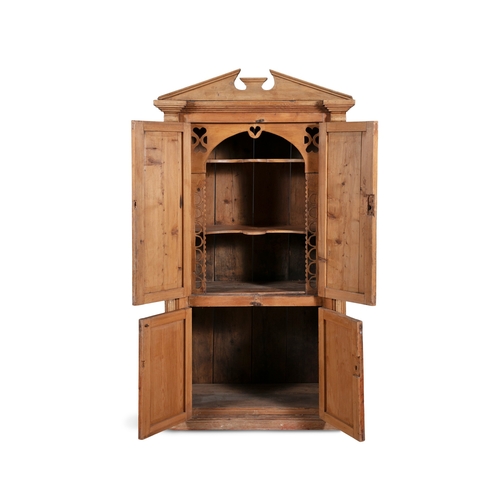 161 - A 19TH CENTURY STRIPPED PINE CUPBOARD WITH ARCHITECTURAL PEDIMENT,  above twin fielded panel doors e... 