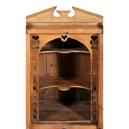 161 - A 19TH CENTURY STRIPPED PINE CUPBOARD WITH ARCHITECTURAL PEDIMENT,  above twin fielded panel doors e... 