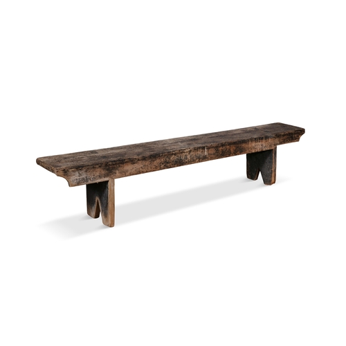 168 - A 19TH CENTURY STAINED LONG BENCH,  with plain seat above a shaped frieze with trestle feet. 39cm hi... 