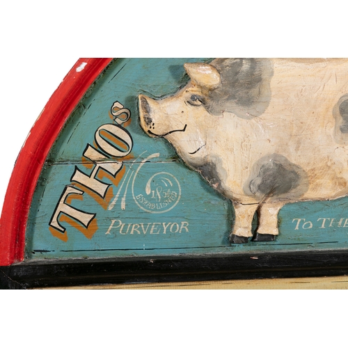 175 - A PAINTED TIMBER SHOP SIGN,   arch top with relief pig and inscribed 'Thomas Brown & Son, Purveyor t... 