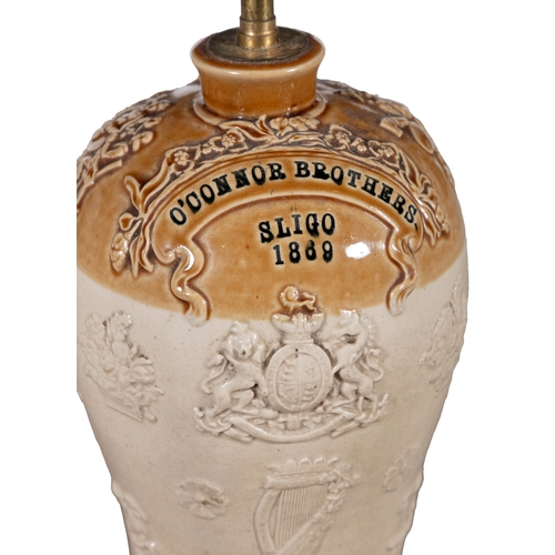 177 - A VICTORIAN GLAZED EARTHENWARE FLAGON,  with cast decoration and inscribed 'O'Connor Brothers, Sligo... 