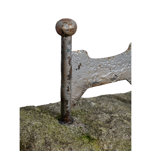 183 - A PAINTED CAST IRON BOOT SCRAPER,  with twin upright supports, on a rectangular limestone base. 42cm... 