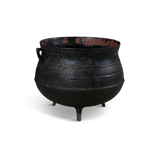 195 - A EARLY 19TH CENTURY LARGE CAST IRON POT,  of circular bulbous form, with out-turned rim, and applie... 