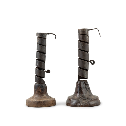 200 - TWO LATE 18TH / EARLY 19TH CENTURY 'RAT DE CAVE' WROUGHT IRON CANDLE HOLDERS,  raised on domed timbe... 