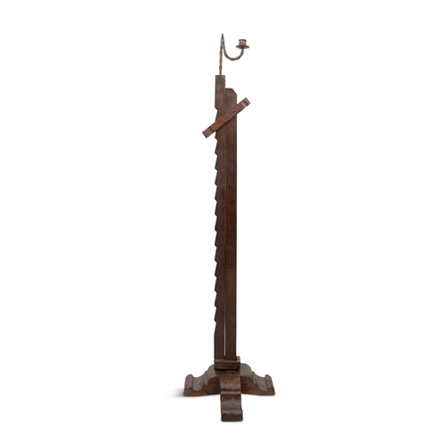 202 - A IRON AND TIMBER ADJUSTABLE RUSH LIGHT,  on X-framed base. 120.5cm high (not extended)